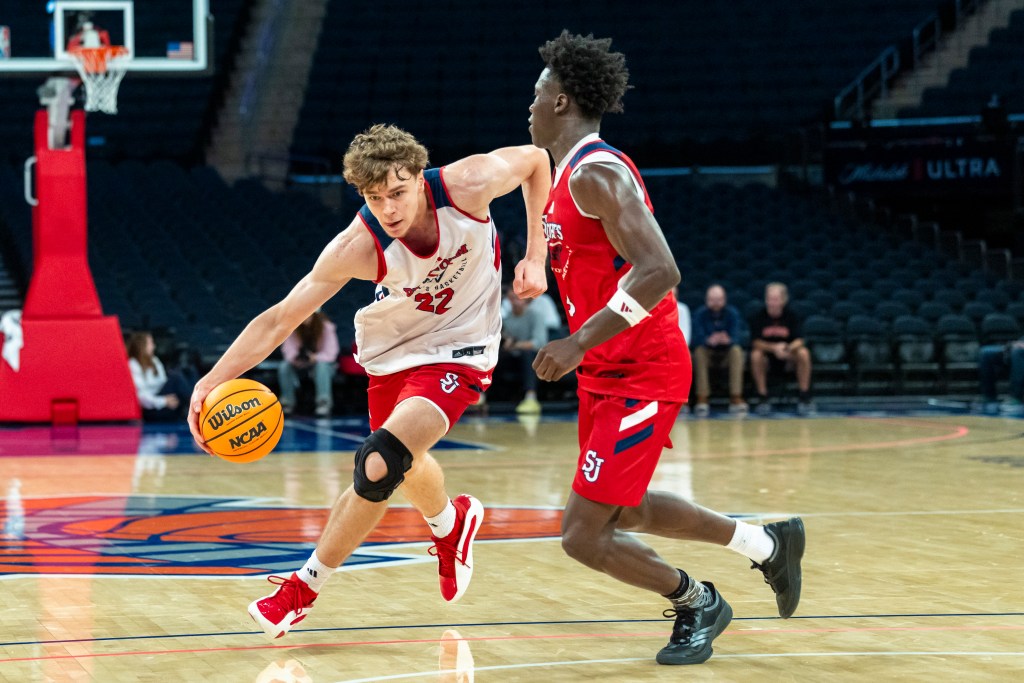 St. John's Red Storm Imran Suljanovic (22) drives around Joson Sanon (3) during a team scrimmage.