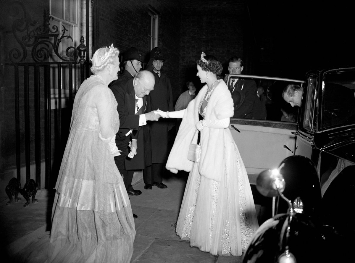 Queen Elizabeth II and the Duke of Edinburgh arrive for a dinner party given by Winston and Clementine Churchill at Downing Street in London on April 4, 1955 (PA Images/Alamy)