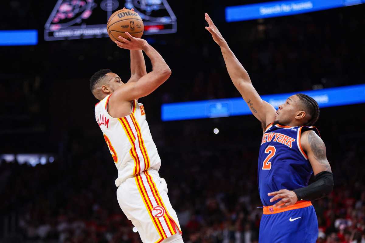 Apr 23, 2026; Atlanta, Georgia, USA; Atlanta Hawks guard CJ McCollum (3) makes the go-ahead basket over New York Knicks guard Miles McBride (2) in the fourth quarter during game three of the first round of the 2026 NBA Playoffs at State Farm Arena. 