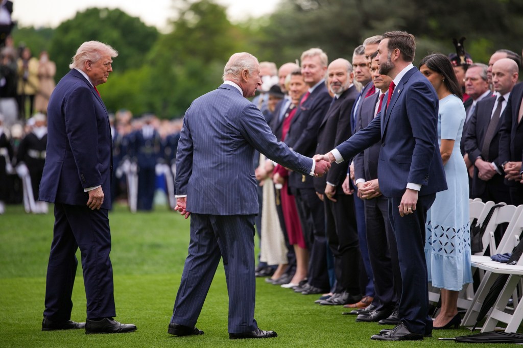  King Charles III greets U.S. Vice President JD Vance as U.S. President Donald Trump looks on.