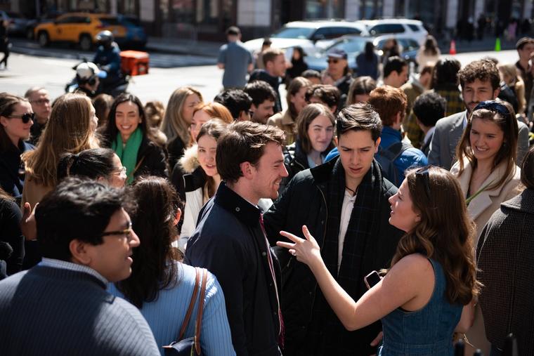 Young adults congregate in fellowship outside of St. Joseph Catholic Church in Greenwich Village.