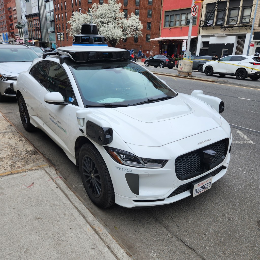 A Waymo car is seen idling on Bowery near Prince Street in Manhattan on April 4, 2026.