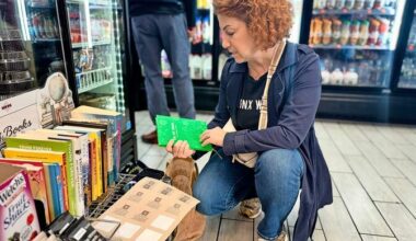 A small shelf of free books sits between everyday items inside a Bronx bodega as part of the &ldquo;BooksxBodegas&rdquo; initiative, which aims to bring reading into spaces residents visit daily.