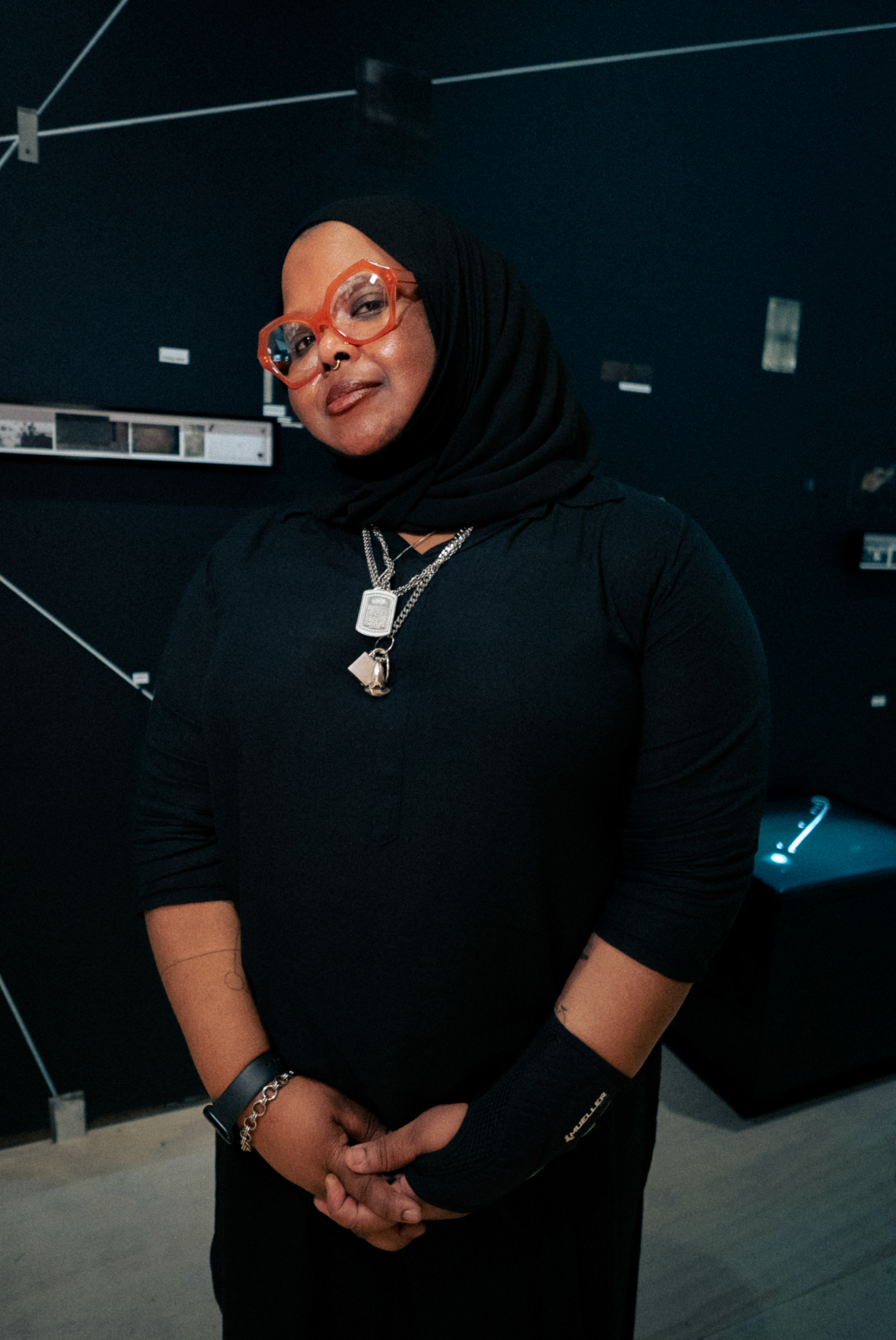 Kameelah Janan Rasheed wearing red glasses at MoMA PS1