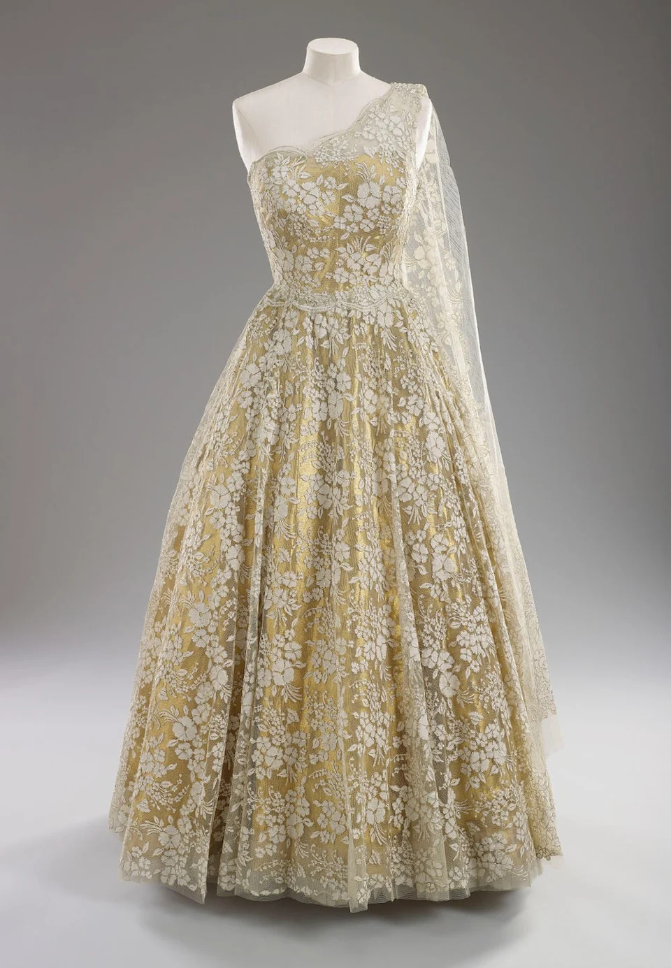 formal gown with floral lace design and a single shoulder strap