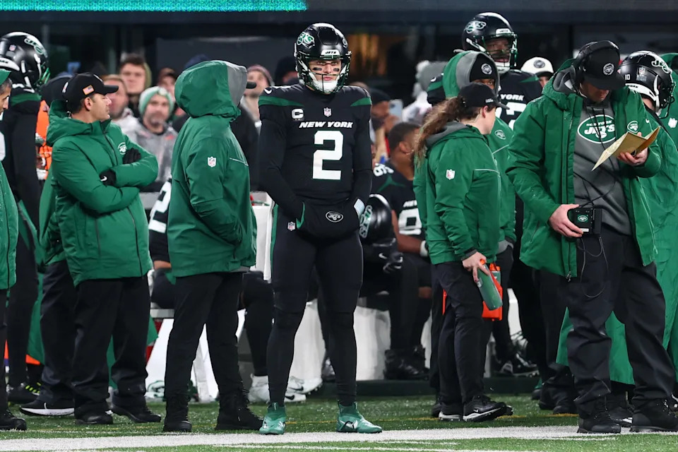 New York Jets quarterback Zach Wilson watches from the sideline after being pulled from the game against the Jacksonville Jaguars.