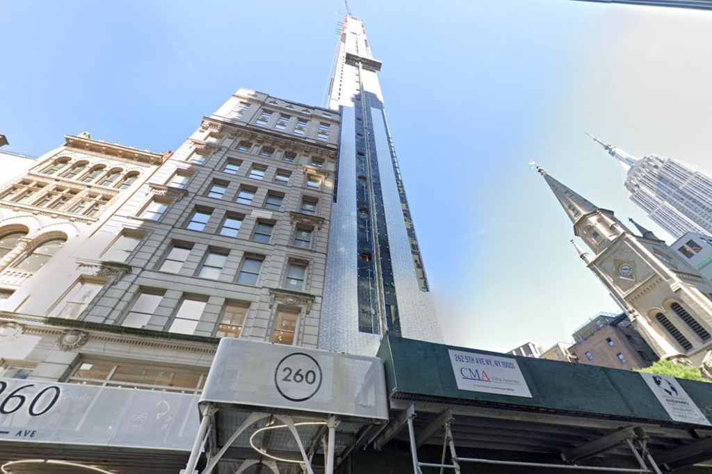 View of 262 Fifth Avenue, a building under construction, next to the Church of the Transfiguration.