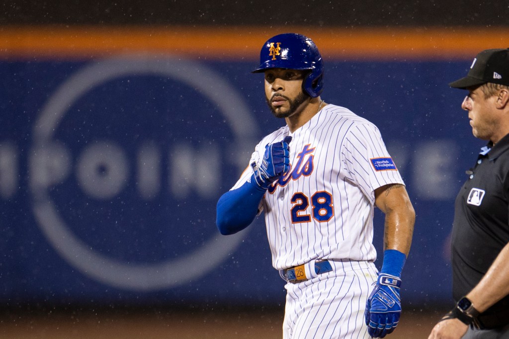 New York Mets left fielder Tommy Pham (28) celebrates a double in the eighth inning.