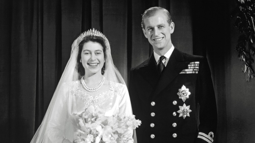 Queen Elizabeth's Norman Hartnell wedding gown is featured in the new show at The King's Gallery, Buckingham Palace.