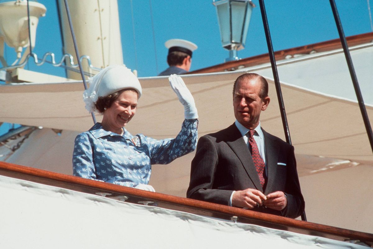 KUWAIT - FEBRUARY 13:  The Queen And Prince Philip Waving On Board Royal Yacht Britannia During An Official Visit To Kuwait During The Tour Of The Gulf  (day Date Not Certain. Gulf Tour Dates 12 Feb - 1 March 1979)  (Photo by Tim Graham Photo Library via Getty Images)