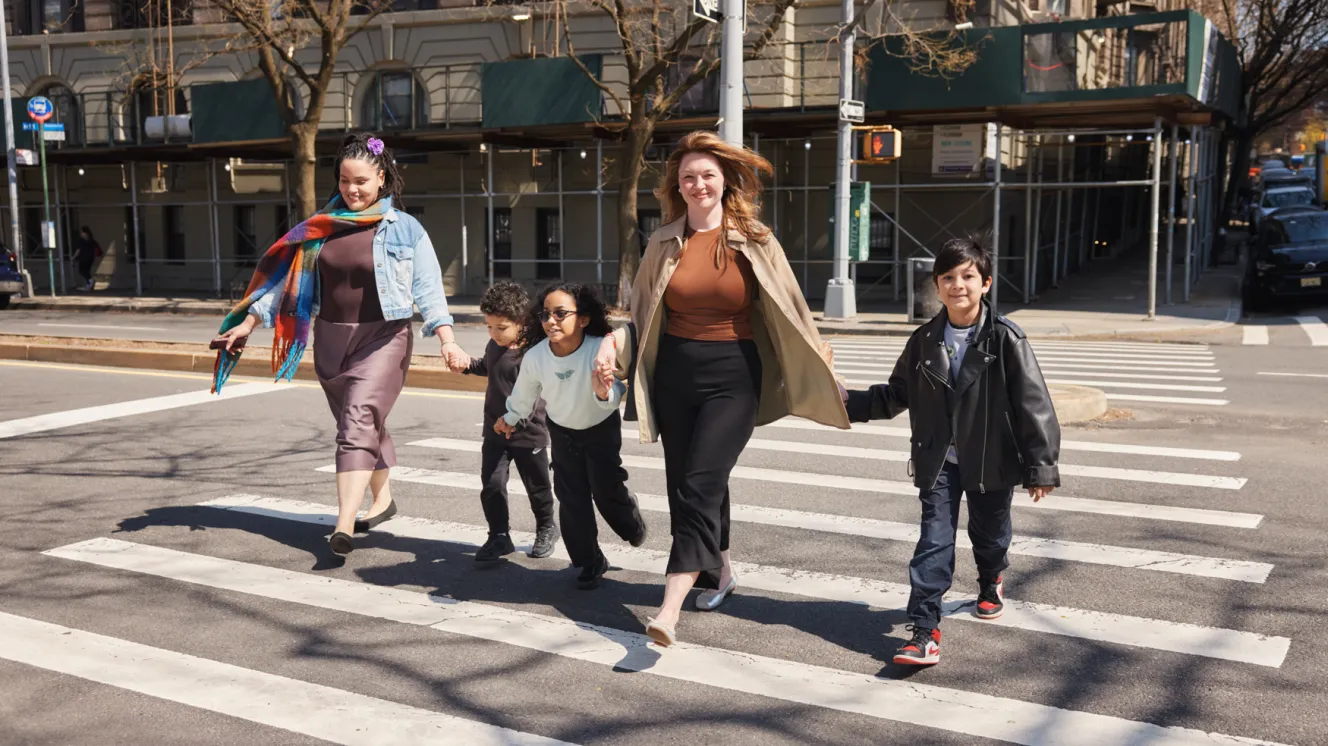 Anabelle Gonzalez and Bernie Sinclaire walking toward Park West Harlem, New York City with Nicolas, Sophia, and Marcos Sinclaire.