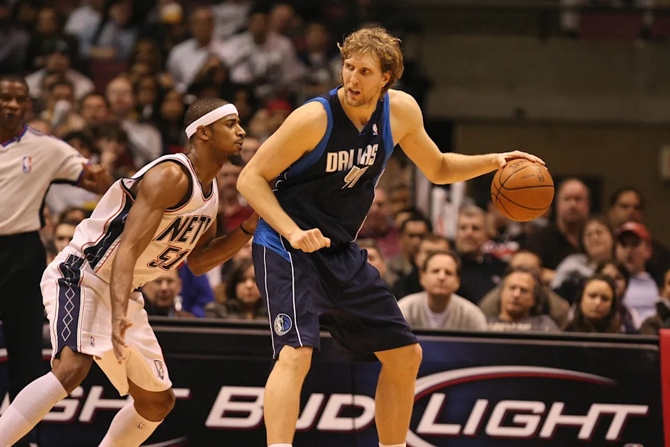 EAST RUTHERFORD, NJ - FEBRUARY 10: Dirk Nowitzki #41 of the Dallas Mavericks moves the ball against Sean Williams #51 of the New Jersey Nets during the game on February 10, 2008 at the Izod Arena in East Rutherford, New Jersey. The Nets won 101-82. NOTE TO USER: User expressly acknowledges and agrees that, by downloading and/or using this Photograph, user is consenting to the terms and conditions of the Getty Images License Agreement. (Photo by Al Bello/Getty Images)