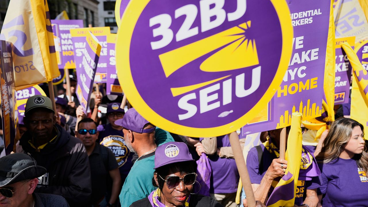 Members of the 32BJ SEIU union and their supporters rally on Park Avenue, in New York, Wednesday, April 15, 2026. (AP Photo/Seth Wenig)
