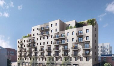 An architectural rendering of a large multifamily building