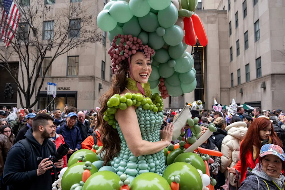 Tommi May wears a costume of balloons as they participate in the Easter Bonnet Parade and Festival on Fifth Avenue, Sunday, April 5, 2026, in New York. (AP Photo/Adam Gray)