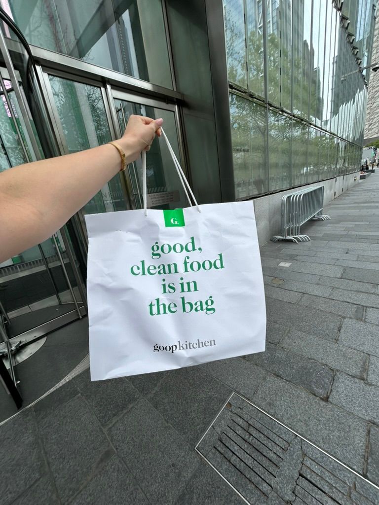 Image may contain Bag Advertisement and Person