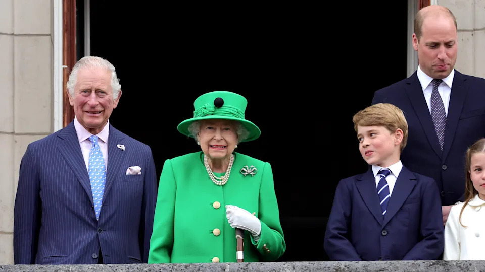 King Charles, Queen Elizabeth II, Prince George and Prince William stand on the balcony during the Platinum Pageant on June 05, 2022