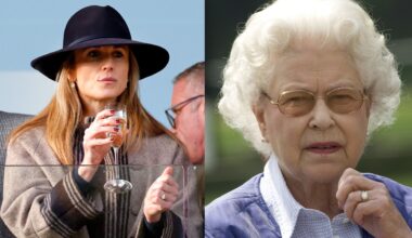 Harriet Sperling wearing a hat and brown coat drinking champagne; Queen Elizabeth looking concerned and holding her hand up