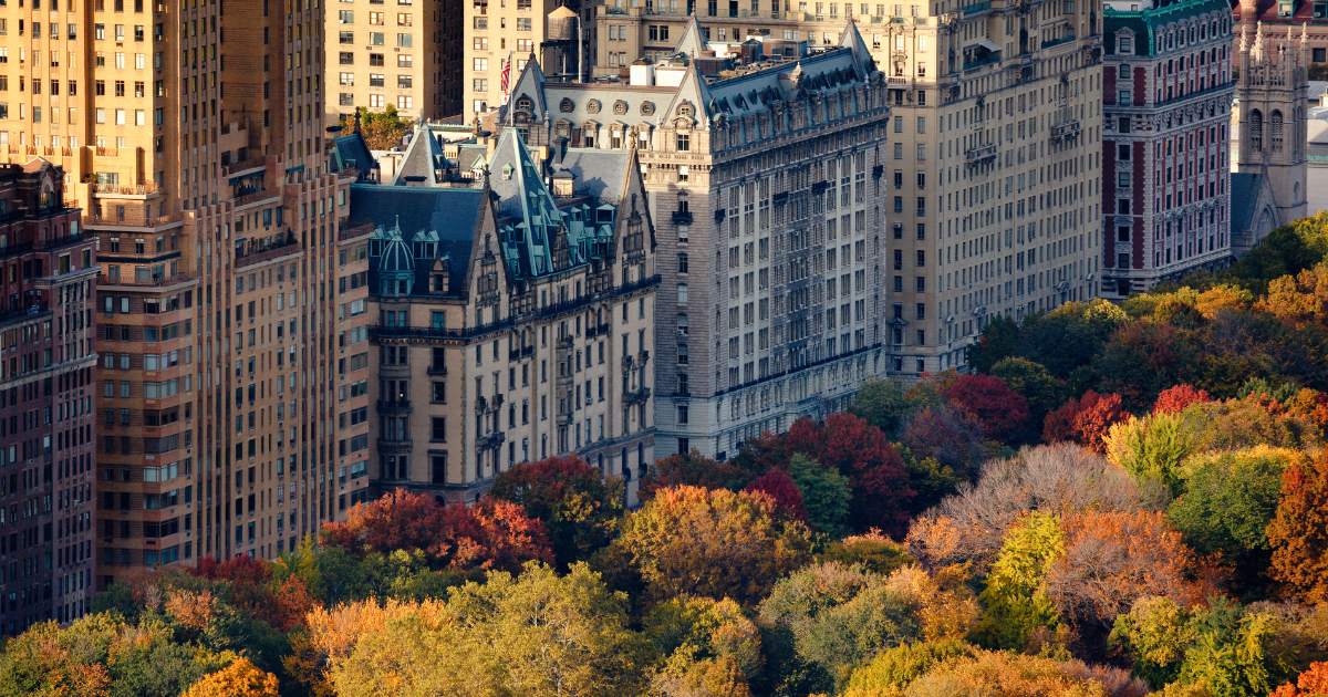 An aerial view of Manhattan's Upper West Side, next to Central Park covered in fall foliage.