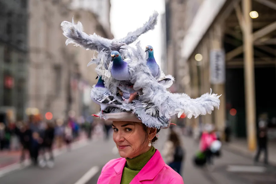 Kerry Auld wears a pigeon themed hat during the Easter Parade and Bonnet Festival on Fifth Avenue, Sunday, April 5, 2026, in New York. (AP Photo/Adam Gray)