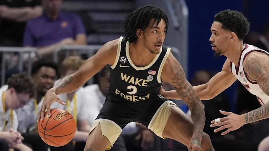 Demon Deacons guard Juke Harris handles the ball guarded by Hokies guard Jailen Bedford. Credit: Jim Dedmon-Imagn Images