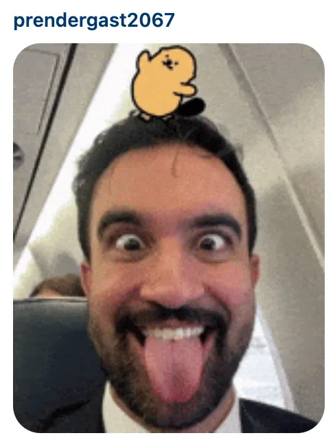 Person making a funny face with tongue out, seated on an airplane. A cartoon of a dancing, small creature is on their head. Username on top: prendergast2067