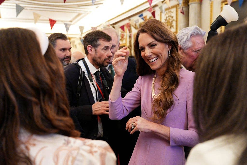 Catherine, Princess of Wales talks with guests as she attends a reception at Buckingham Palace, on the 100th anniversary of the birth of Queen Elizabeth II