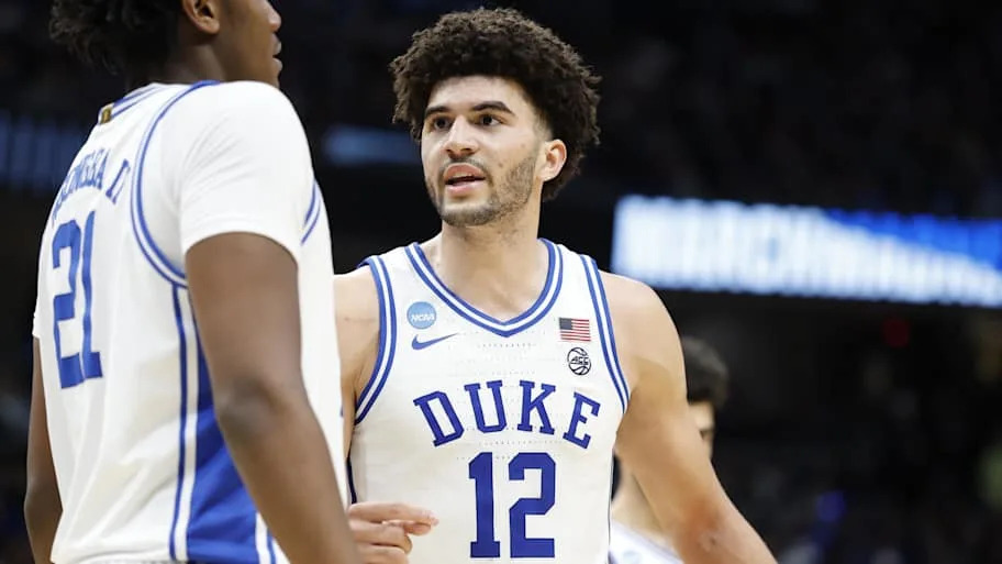 Duke Blue Devils forward Cameron Boozer (12) talks to Blue Devils center Patrick Ngongba (21). Amber Searls-Imagn Images