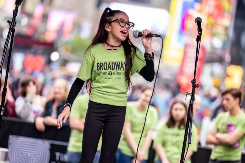 kid singing on stage