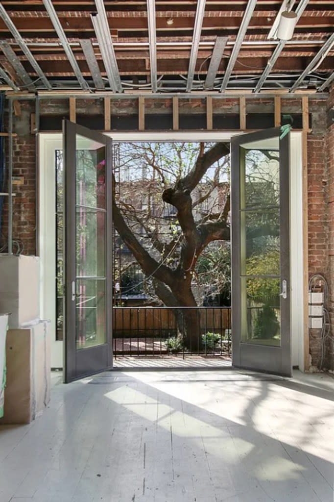Craig and Weisz purchased the detached property from author Martin Amis and his wife Isabel Fonseca, and rebuilt it into a finished family home with a west-facing backyard anchored by a large mulberry tree. Corcoran Group