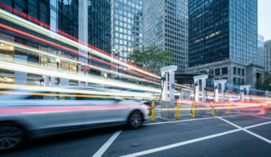 A dynamic, abstract color photograph with sweeping, blurred brushstrokes of vibrant hues representing the motion and energy of electric vehicles charging at a public station in New York City.