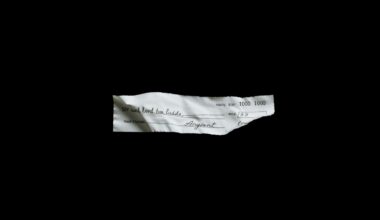 An extreme close-up photograph of a crumpled, torn check against a pitch-black background, lit by a harsh, direct camera flash, conceptually representing the financial fraud and exploitation of the elderly.