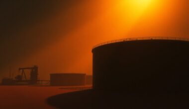 A serene, cinematic painting of an oil refinery or storage tank, with warm sunlight casting long shadows across the scene, capturing the sense of uncertainty and political tension surrounding the situation in Venezuela.