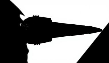 A stark, geometric black silhouette of a microphone against a plain white background, conveying the high-stakes drama and excitement of a singing competition.