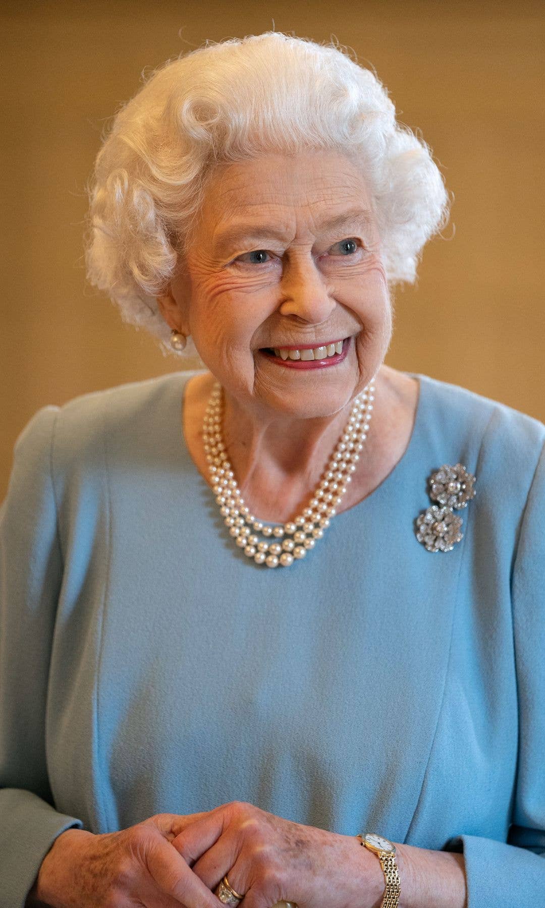 Queen Elizabeth II smiles during a reception in the Ballroom of Sandringham House