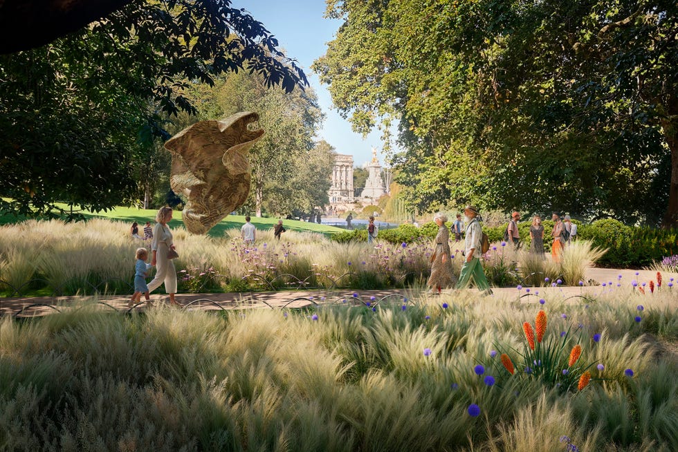 A vibrant park scene with visitors walking along a pathway.