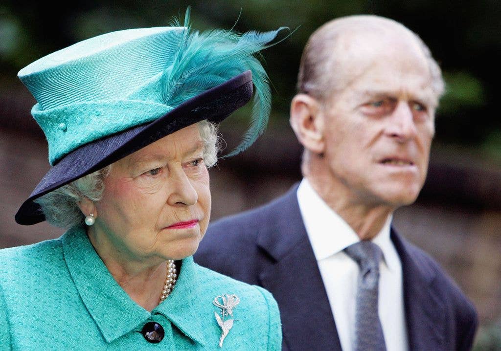 LONDON - OCTOBER 27:  (NO PUBLICATION IN UK MEDIA FOR 28 DAYS)  Queen Elizabeth II and Prince Philip The Duke of Edinburgh look on as Norway's King Harald unveils a statue of the late Queen Maud of Norway at the Norwegian Ambassador's Residence on October 27, 2005 in London, England. (Photo by POOL Tim Graham Picture Library/Getty Images)