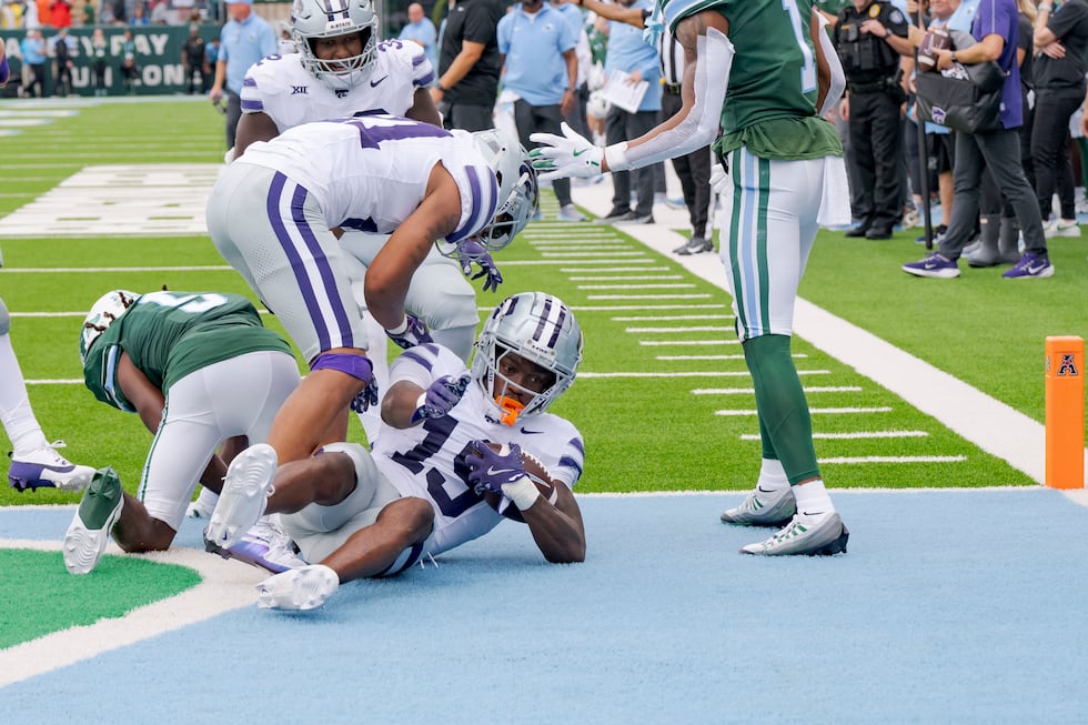Kansas State safety VJ Payne (19) comes down with an interception against Tulane wide receiver...