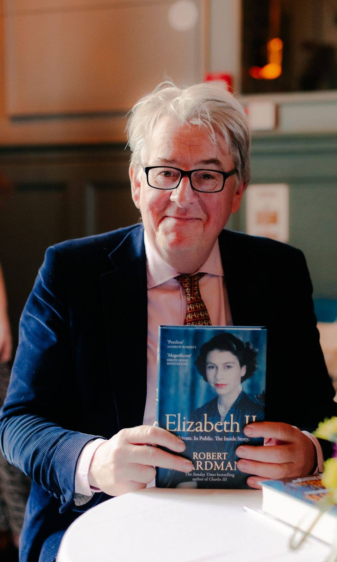 Robert Hardman poses with his new book Elizabeth II