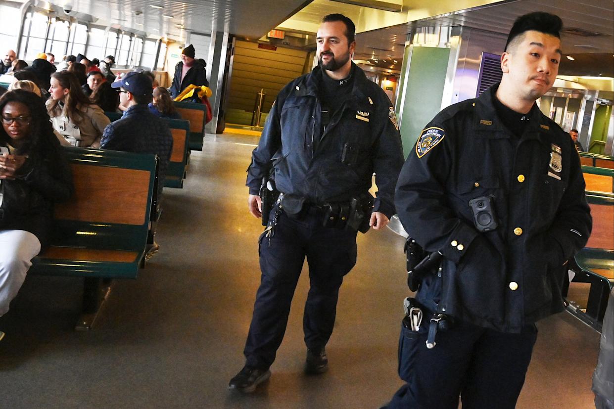 Cops are seen walking around the Staten Island ferry.