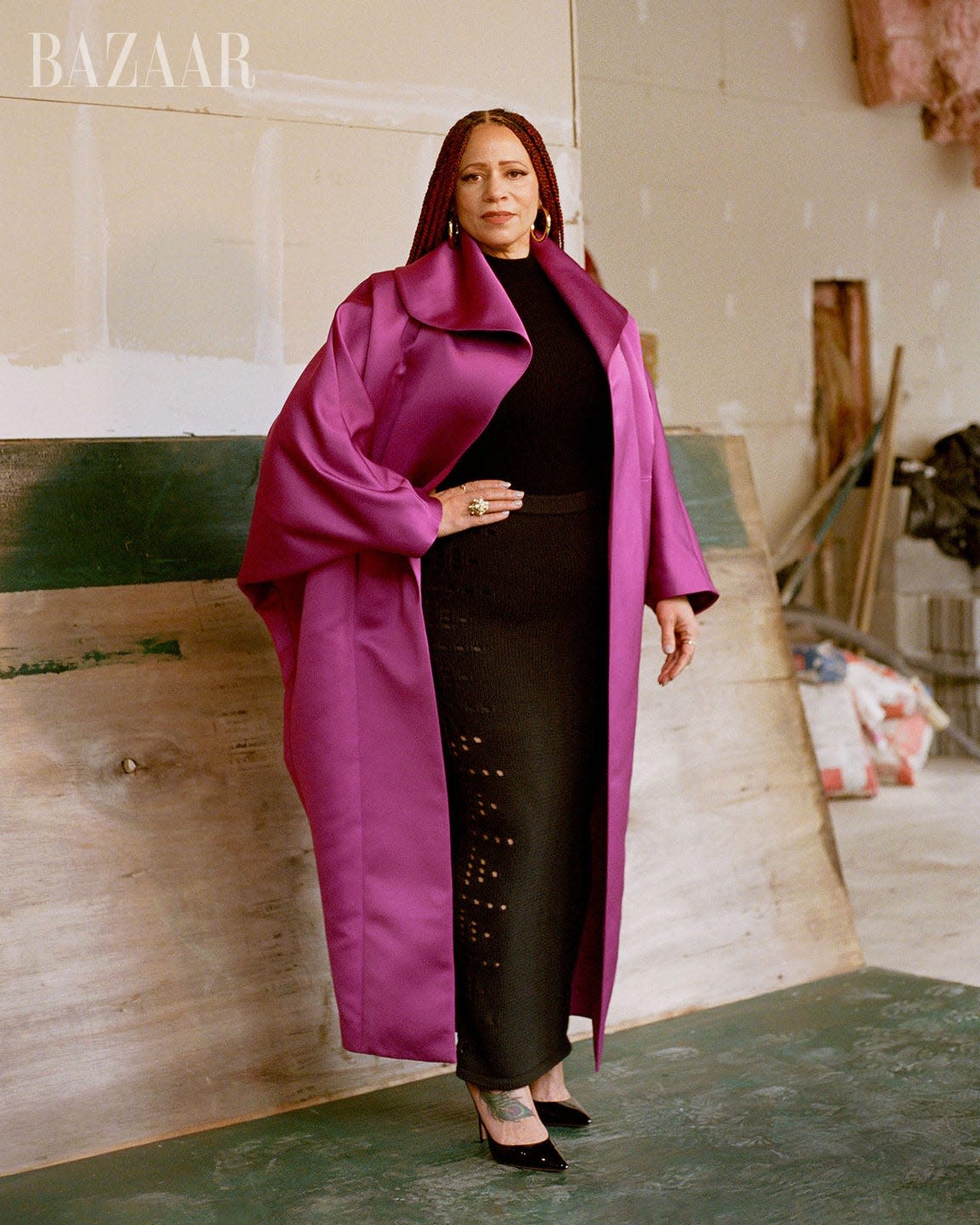 Fashion model in a striking outfit showcasing bold colors.