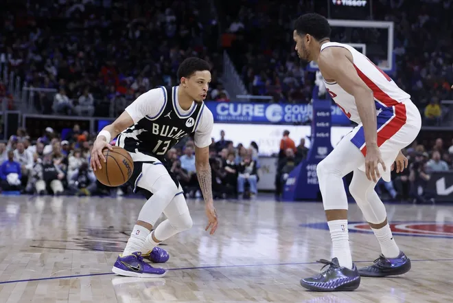 Apr 08, 2026; Detroit, MI, USA; Milwaukee Bucks guard Ryan Rollins (13) dribbles the ball against Detroit Pistons forward Tobias Harris (12) in the second half at Little Caesars Arena.