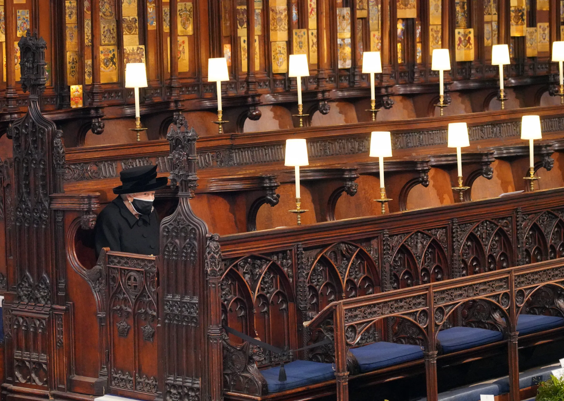 Queen Elizabeth II seated alone in St. George's Chapel during the funeral of Prince Philip.