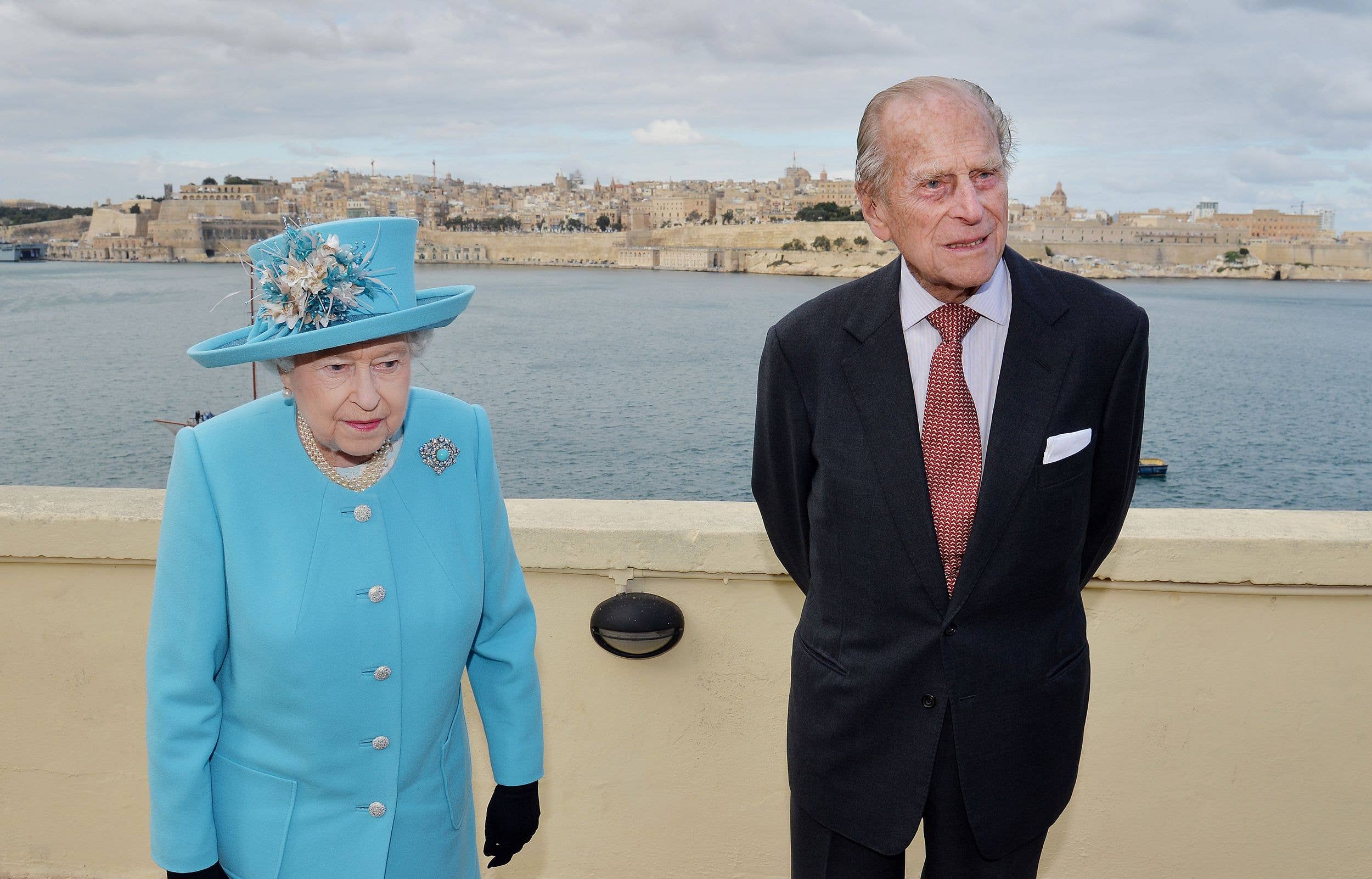 VALLETTA, MALTA - NOVEMBER 28: Queen Elizabeth II and Prince Philip, Duke of Edinburgh after looking at the view from the Kalkara heritage site in Valletta Harbour on November 28, 2015 in Valletta, Malta. Queen Elizabeth II, The Duke of Edinburgh, Prince Charles, Prince of Wales and Camilla, Duchess of Cornwall are in Malta on the final day of a visit to the island that has been hosting the Commonwealth Heads of State Summit.  (Photo by John Stillwell - Pool/Getty Images)