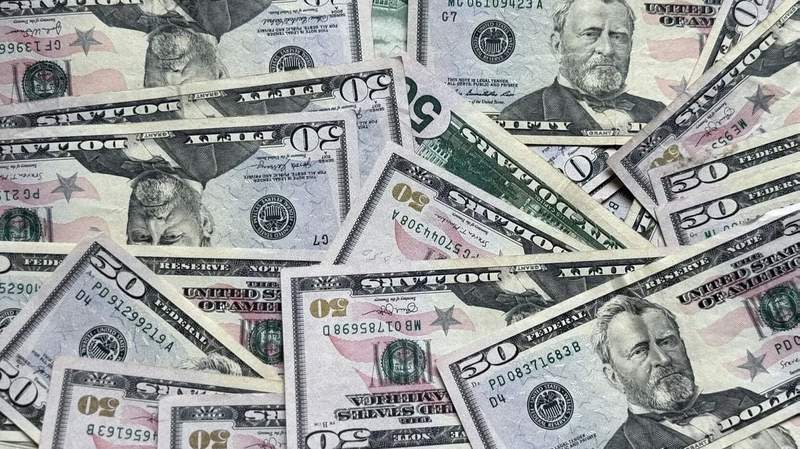 A pile of U.S. fifty-dollar bills is displayed. Photo: Emilee Calametti / The Center Square