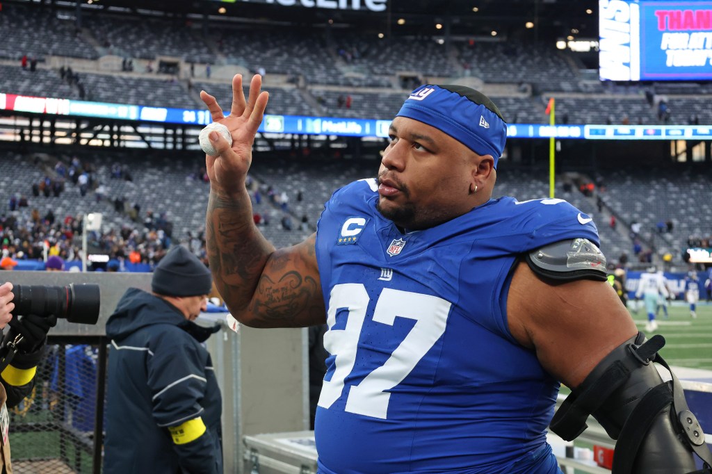 New York Giants defensive tackle Dexter Lawrence II (97) waves to fans after defeating the Dallas Cowboys.