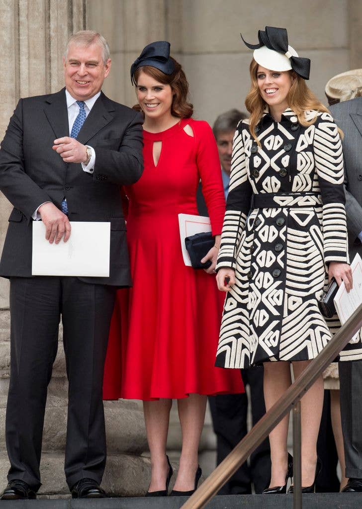 Andrew Mountbatten-Windsor stands next to daughters Eugenie and Beatrice.