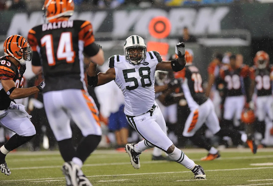 New York Jets Bryan Thomas rushes after the Cincinnati Bengals Andy Dalton.