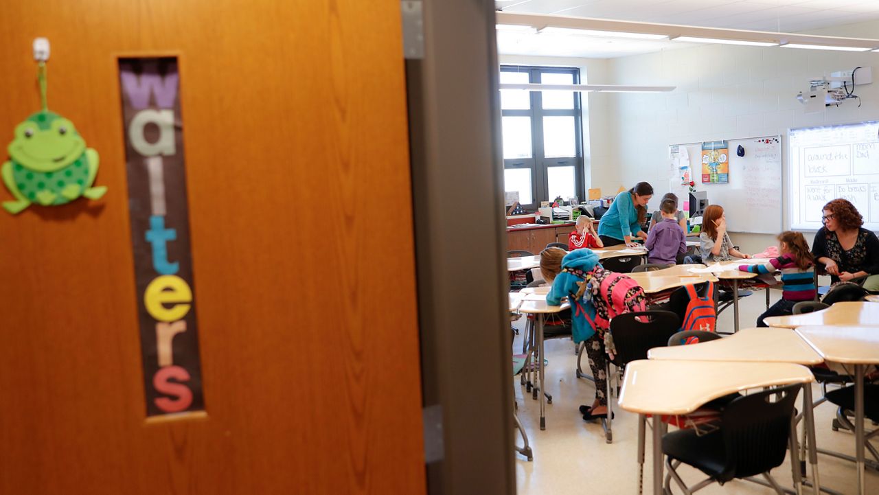 students are helped with their homework in the classroom