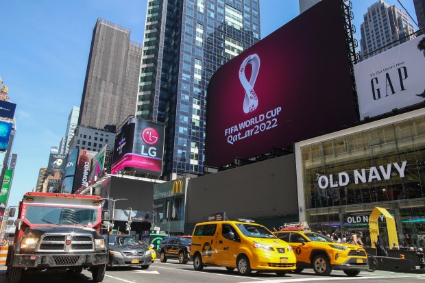 FILE - An electronic billboard displays a FIFA World Cup Qatar 2022 soccer logo, Tuesday, Sept. 3, 2019, in New York's Times Square. (AP Photo/Mary Altaffer)